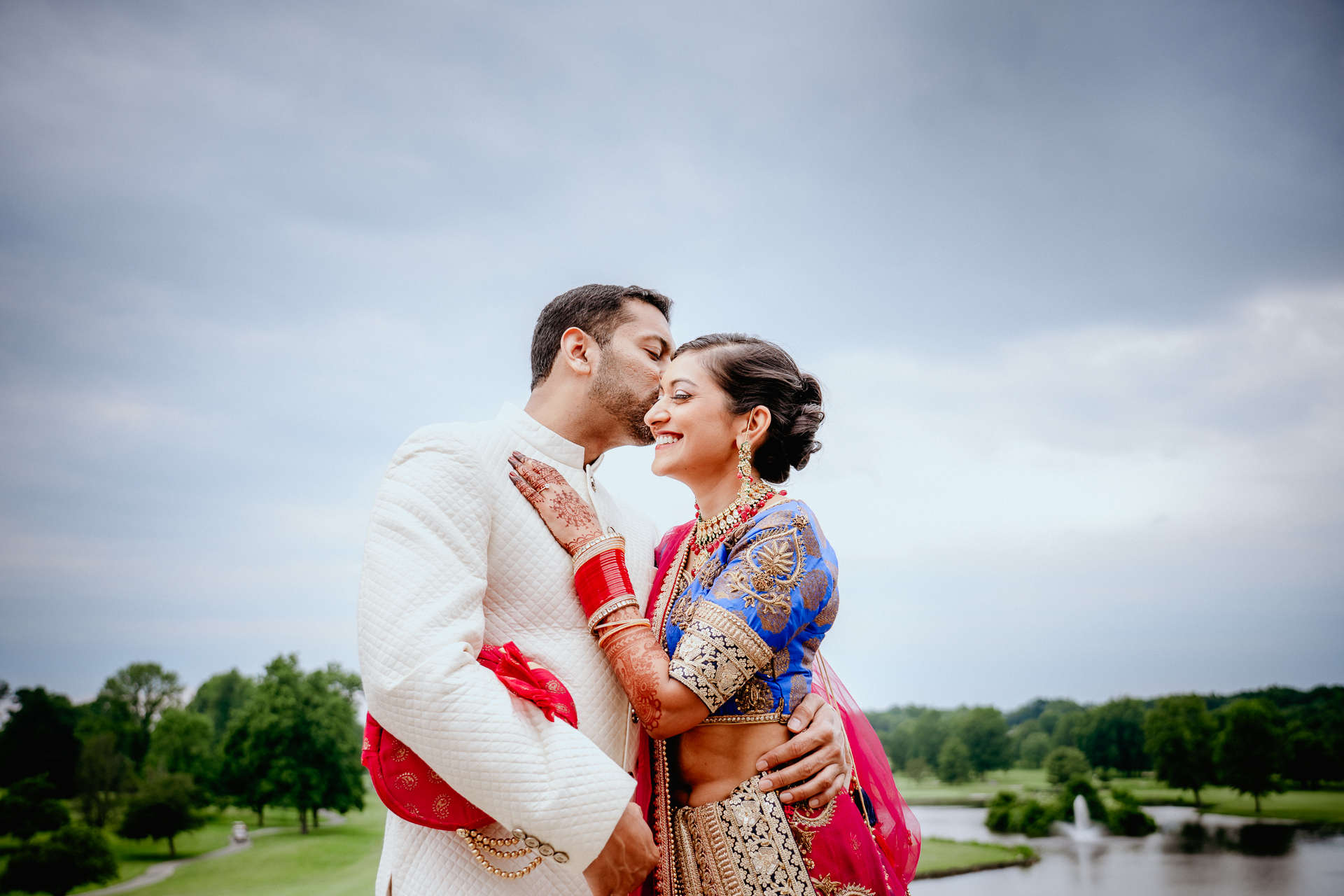 Bold Outdoor Indian Wedding | PreOwned Wedding Dresses | Wedding couple  poses, Indian wedding couple, Indian wedding photography poses